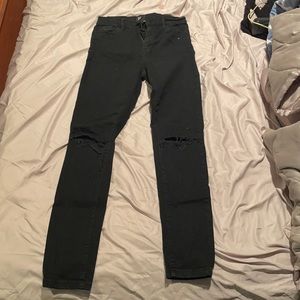 Black urban outfitters skinny jeans with rip